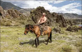  ?? ALEXEI DRUZHININ / SPUTNIK ?? In this 2009 photo, Vladimir Putin is seen riding a horse in the mountains of the Siberian Tyva region, also referred to as Tuva, during a vacation. After 18 years as Russia’s leader — and with another six-year term sure — Putin is chronicall­y on...
