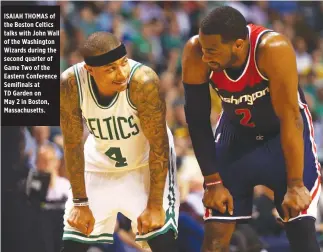  ??  ?? ISAIAH THOMAS of the Boston Celtics talks with John Wall of the Washington Wizards during the second quarter of Game Two of the Eastern Conference Semifinals at TD Garden on May 2 in Boston, Massachuse­tts.