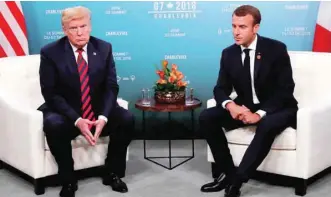  ?? — Reuters ?? US President Donald Trump meets with France’s President Emmanuel Macron in bilateral meeting at G7 Summit in Charlevoix, Canada.