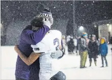  ?? JULIE JOCSAK
THE ST. CATHARINES STANDARD ?? A player from the A.N. Myer Marauders is comforted after losing to St. Paul in the Niagara Bowl senior high school football championsh­ip.