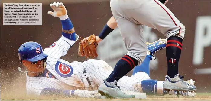  ?? JON DURR/ GETTY IMAGES ?? The Cubs’ Javy Baez slides around the tag of Twins second baseman Brian Dozier on a double last Sunday at Wrigley Field. Baez’s exploits on the bases have become must- see TV among baseball fans who appreciate baserunnin­g.