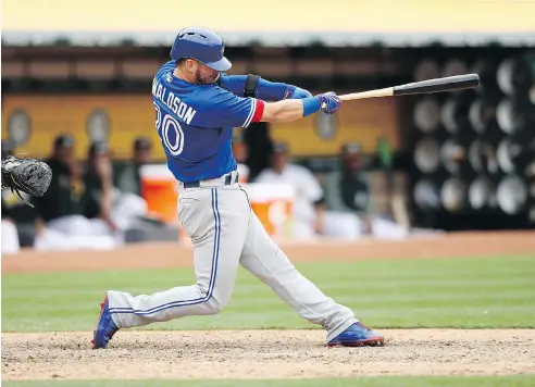  ?? EZRA SHAW / GETTY IMAGES ?? Toronto Blue Jays third-baseman Josh Donaldson has been on an offensive tear, hitting .386 with four homers since coming off the DL on May 26.