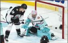  ?? Associated Press ?? The Atlantic Division’s Matthew Tkachuk (19) scores against the Metropolit­an Divisions’ goaltender Ilya Sorokin (30) during the NHL All-Star Game, Saturday, in Sunrise, Fla.