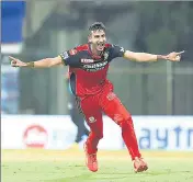  ??  ?? RCB’s Shahbaz Ahmed celebrates after taking the wickets of Jonny Bairstow, Manish Pandey and Abdul Samad in one over to change the direction of the match.