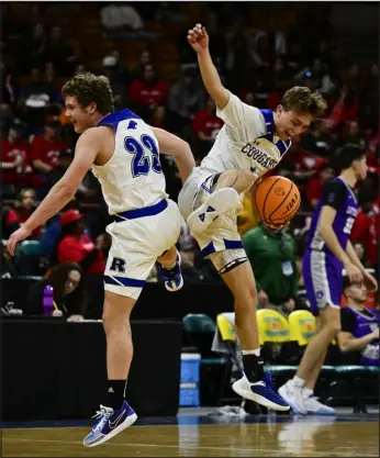  ?? ANDY CROSS — THE DENVER POST ?? Resurrecti­on Christian’s Egan Koenig, left, and Ty Yoder celebrate after defeating the Lutheran Lions 51-45 at the Denver Coliseum on Friday.