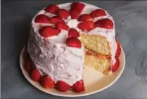  ?? GORAN KOSANOVIC, FOR THE WASHINGTON POST ?? Strawberry Cake: Pretty in pink, this is a family recipe from circus cook Sarah Chapman that dates back 140 years.