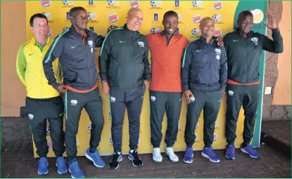  ??  ?? SA Under-20 coach Thabo Senong, second right, with his technical staff during a media day this week.