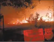  ?? COURTESY OF CHARLES JOHNSTON ?? The Tubbs fire burns at the Helena View Johnston winery and vineyards in Calistoga.