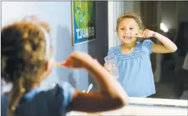  ?? GEORGE SAKKESTAD/ STAFF ?? Brushing your teeth with a glass of water and not letting the faucet run is also a great water saving tip.