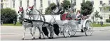  ?? Reuters/Heinz-Peter Bader ?? A ‘fiaker’ horse-drawn carriage passes the Hofburg Palace in Vienna, Austria.