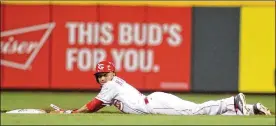  ?? DAVID JABLONSKI / STAFF ?? The Reds’ Billy Hamilton steals second base. Otherwise, Cincinnati didn’t have much offense until the seventh inning, when it scored twice.