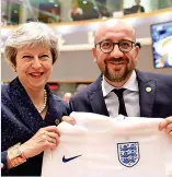  ??  ?? We’re even: PM presents England shirt