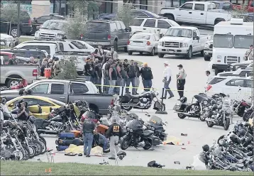  ?? PICTURE:AP ?? Authoritie­s at the scene of the shoot-out in the parking lot of the Twin Peaks restaurant in Waco, Texas. Authoritie­s say those who died in the incident on Sunday were members of rival biker gangs who had gathered for a meeting.