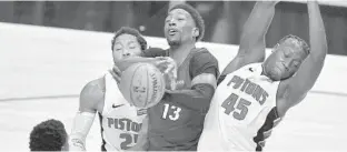  ?? MICHAEL LAUGHLIN\SUN SENTINEL ?? The Heat’s Bam Adebayo runs into the Pistons’ Sekou Doumbouya on Saturday.