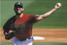  ?? Ralph Freso / Getty Images ?? Arizona’s Madison Bumgarner struck out six in two innings.