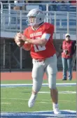  ??  ?? Lowville QB Chad Bach looks for an open receiver during the first half of a 49-15win over Canastota in the Class C semifinals on Saturday, Nov. 2.