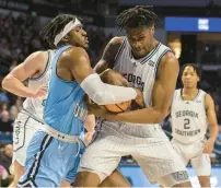  ?? ?? Old Dominion forward Dericko Williams (23) fights for the ball with Georgia Southern guard Jalen Finch during the first half on Saturday at Chartway Arena.