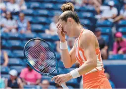  ?? JOHN MINCHILLO/AP ?? No. 3 seed Maria Sakkari, of Greece, reacts after dropping a point during a 7-5, 7-5 loss to China’s Wang Xiyu in the second round of the U.S. Open on Wednesday.