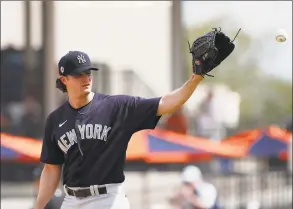  ?? Carlos Osorio / Associated Press ?? New York Yankees starting pitcher Gerrit Cole receives a new ball during a spring training game against the Detroit Tigers in March.