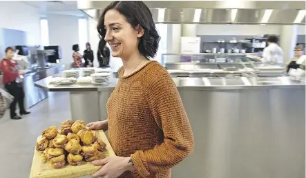  ?? ED KAISER ?? Alysha Durovick serves sandwiches made in the new commercial kitchen at NorQuest College.