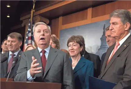  ?? J. SCOTT APPLEWHITE/AP ?? Sen. Lindsey Graham, R-S.C., leads a group of senators urging President Trump to support a bipartisan immigratio­n deal Thursday in Washington. The president didn’t, and the bill never got the required votes to pass.