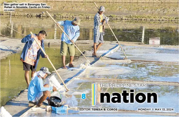  ?? EDD GUMBAN ?? Men gather salt in Barangay San Rafael in Noveleta, Cavite on Friday.