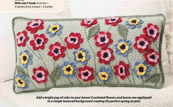  ??  ?? Add a bright pop of color to your home! Crocheted flowers and leaves are appliquéd to a simple textured background creating the perfect spring accent!