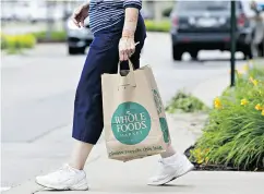  ?? DANIEL ACKER / BLOOMBERG ?? Amazon.com’s offer of US$13.7 billion to buy Whole Foods, representi­ng a multiple of 10 times earnings before interest, tax, depreciati­on and amortizati­on, could possibly be raised to 11 or 12 times.