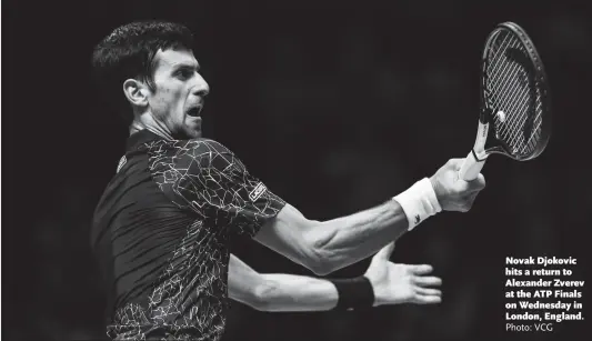  ?? Photo: VCG ?? Novak Djokovic hits a return to Alexander Zverev at the ATP Finals on Wednesday in London, England.