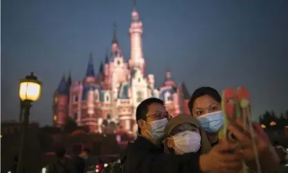  ?? Photograph: Hu Chengwei/Getty Images ?? Visitors at Shanghai Disneyland where US attorney general William Barr says government officials are allowed a management role.