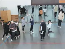  ?? PROVIDED TO CHINA DAILY ?? Performers of Chinese musical SoulFerry at a recent rehearsal in Beijing, being instructed by Ma Da (front right), the musical’s director and lyricist.