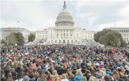  ?? Andrew Harnik, The Associated Press ?? Students rally Wednesday outside the U.S. Capitol in Washington, D.C. Students walked out of school to protest gun violence in the biggest demonstrat­ion yet of the student activism that has emerged in response to last month's massacre of 17 people at...