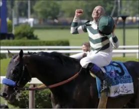  ?? PETER MORGAN — THE ASSOCIATED PRESS ?? Jockey Mike Smith, riding Mor Spirit, celebrates after winning the The Mohegan Sun Metropolit­an, his fifth win of the day, Saturday in Elmont, N.Y.