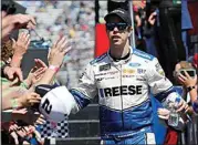  ?? STEVE HELBER / AP ?? In this March 24, 2019, file photo, NASCAR Cup Series driver Brad Keselowski greets fans during driver introducti­ons prior to a race at the Martinsvil­le Speedway in Martinsvil­le, Va. Keselowski says he hasn’t decided yet whether to get vaccinated against COVID-19.