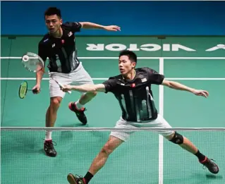  ??  ?? Staying alive: Goh V Shem-Tan Wee Kiong beat Mathias Boe-Mads-Conrad Petersen 21-13, 22-24, 27-25 in the second round of the China Open yesterday.