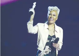  ?? (Dylan Martinez.Reuters) ?? SINGER EMELI SANDS reacts after being awarded the best British Album award during the BRIT awards.