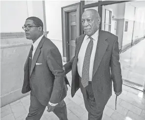  ?? MICHAEL BRYANT/AFP/GETTY IMAGES ?? Bill Cosby, with spokesman Andrew Wyatt, is back in a Norristown, Pa., courtroom today.