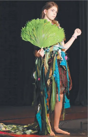  ??  ?? STYLE: Hannah Burnett, 12, prepares for Cairns State High School’s fashion parade. Picture: JUSTIN BRIERTY