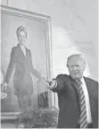  ?? AUDE GUERRUCCI, POOL PHOTO ?? President Trump and a portrait of Hillary Clinton.