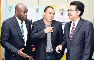  ?? IAN ALLEN/PHOTOGRAPH­ER ?? Professor of Public Health Nutrition at the University of Technology Fitzroy Henry (left) shares a moment with Minister of Health Dr Christophe­r Tufton (centre) and Professor Stephen Vasciannie, president of the University of Technology, during a...