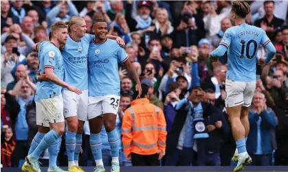  ?? Photograph: Robbie Jay Barratt/ AMA/Getty Images ?? Erling Haaland is congratula­ted by his Manchester City teammates after making it 1-0 against Brighton.