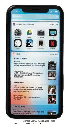  ?? Richard Drew / Associated Press ?? The new XR phone has a larger display and loses the home button to make room for more screen.
