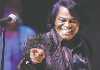  ??  ?? James Brown, seen here in 2003, helped keep the peace during a concert in Boston the night after Martin Luther King Jr. was assassinat­ed in April 1968. HENNING KAISER/DDP/AFP VIA GETTY IMAGES