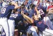  ?? REBECCA S. GRATZ AP ?? Mississipp­i players celebrate after 4-2 victory over Oklahoma to win Game 2 of College World Series.