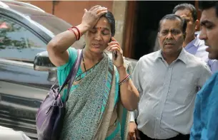  ?? AP ?? Asha Devi, mother of the victim and her husband at the Supreme Court complex in New Delhi. —