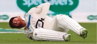  ?? REUTERS PIC ?? England wicket-keeper Jonny Bairstow reacts after sustaining an injury during their third Test against India yesterday.