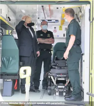  ??  ?? Prime Minister Boris Johnson speaks with paramedics
