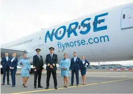  ?? NORSE ATLANTIC AIRWAYS ?? A Norse Atlantic Airways flight crew poses in front of one of the company’s 15 Boeing 787 Dreamliner­s. The discount internatio­nal airline was scheduled to launch its first flight to Berlin from Fort Lauderdale-Hollywood Internatio­nal Airport late Wednesday. It started service to Oslo, Norway, from Broward County in June.