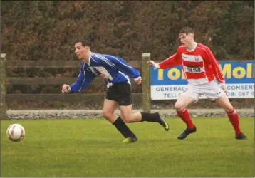  ??  ?? Mark Atkins of Gorey Rangers is tracked by Craig Peare of Moyne Rangers during their Youths Premier Division match on Saturday.