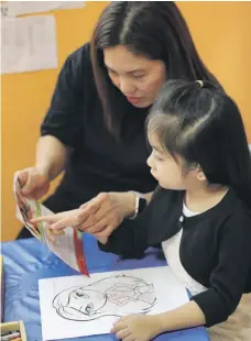  ??  ?? Welma De Leon and her daughter Elijah, 5, who is autistic. Her communicat­ion has improved because of the centre’s help